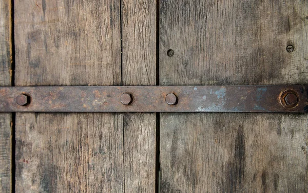 Old wooden vintage door with old metal door handle