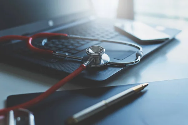 Close up of red stethoscope on desk,Healthcare and medical concept,Selective focus