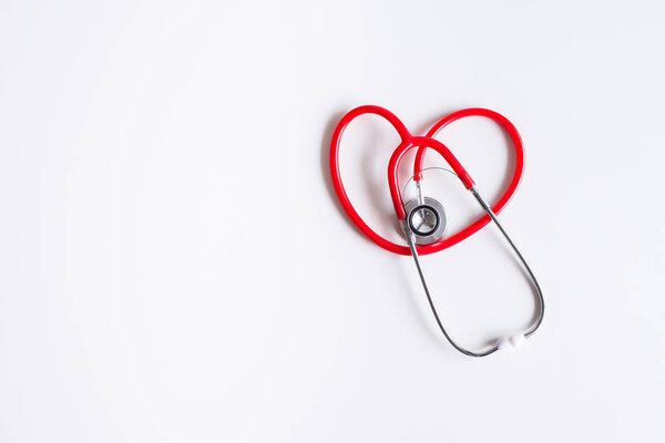 Stethoscope red on table,Healthcare and medical concept,Selective focus