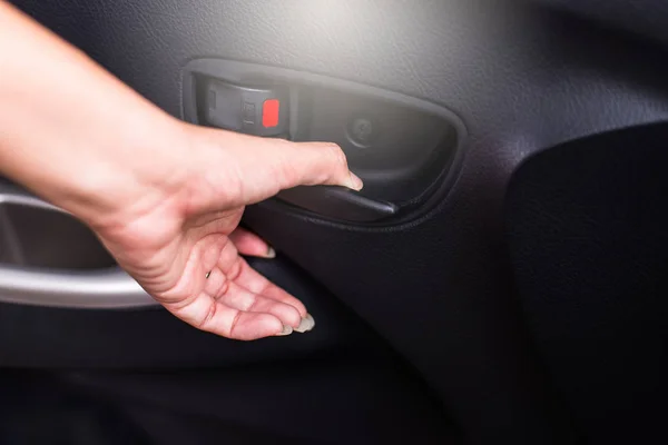Hand using car open door lock inside sytem,Safety door lock