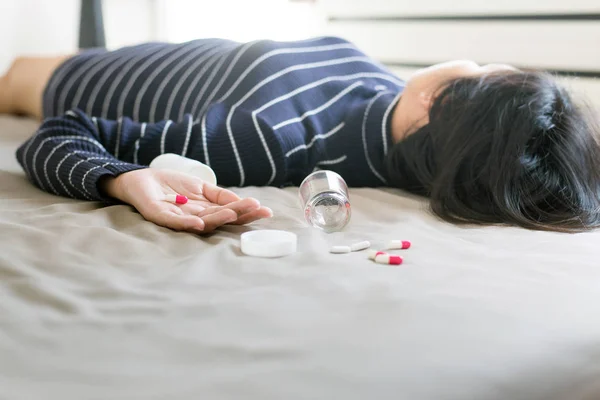 Woman sleep unconscious after eaten pills,Drug overdose concept