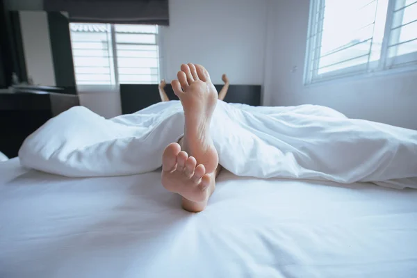 Close Barefoot Feet Stretch Lazily Bed Waking — стоковое фото