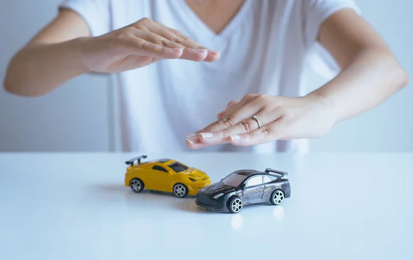 Car model with hand,Business and finance concept