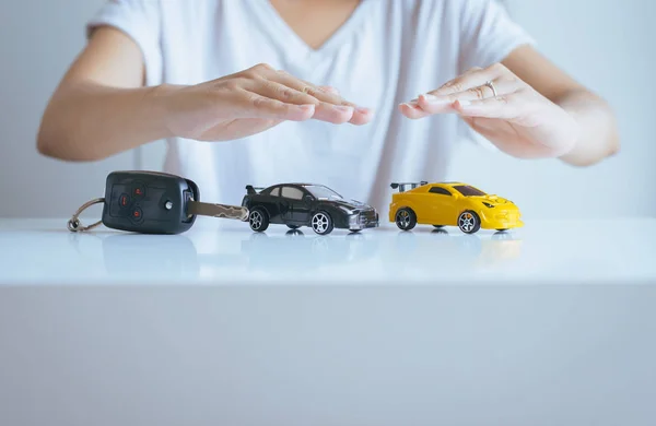 Car model with hand,Business and  cars finance concept