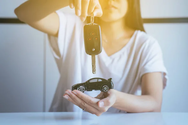 Car model on hand,Business and finance concept