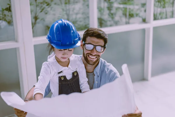 Architect father and his child girl working together at office,Laughing and funny,Happy loving family