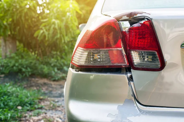 Car rear light with bumper scrash and broken by accident on road,Car insurance concept