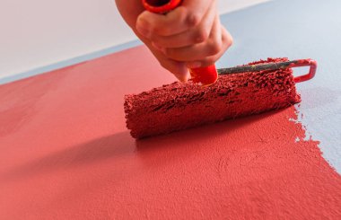 Paint roller on the wall. clipart