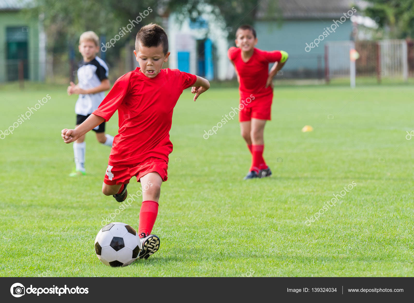 Boy Kicking Soccer Ball Stock Photo C Fotokostic Boy Kicking Soccer Ball Stock Photo C Fotokostic