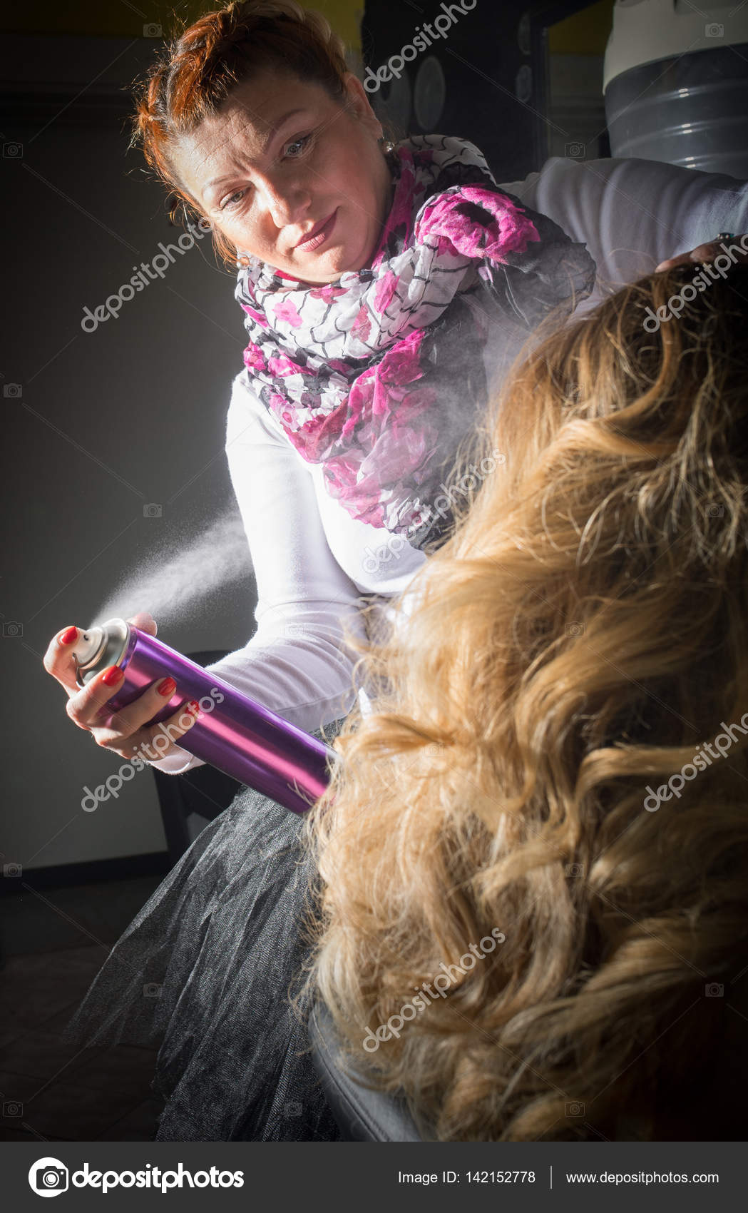 Hairdresser Applying Hair Spray On Ombre Hair Stock Photo