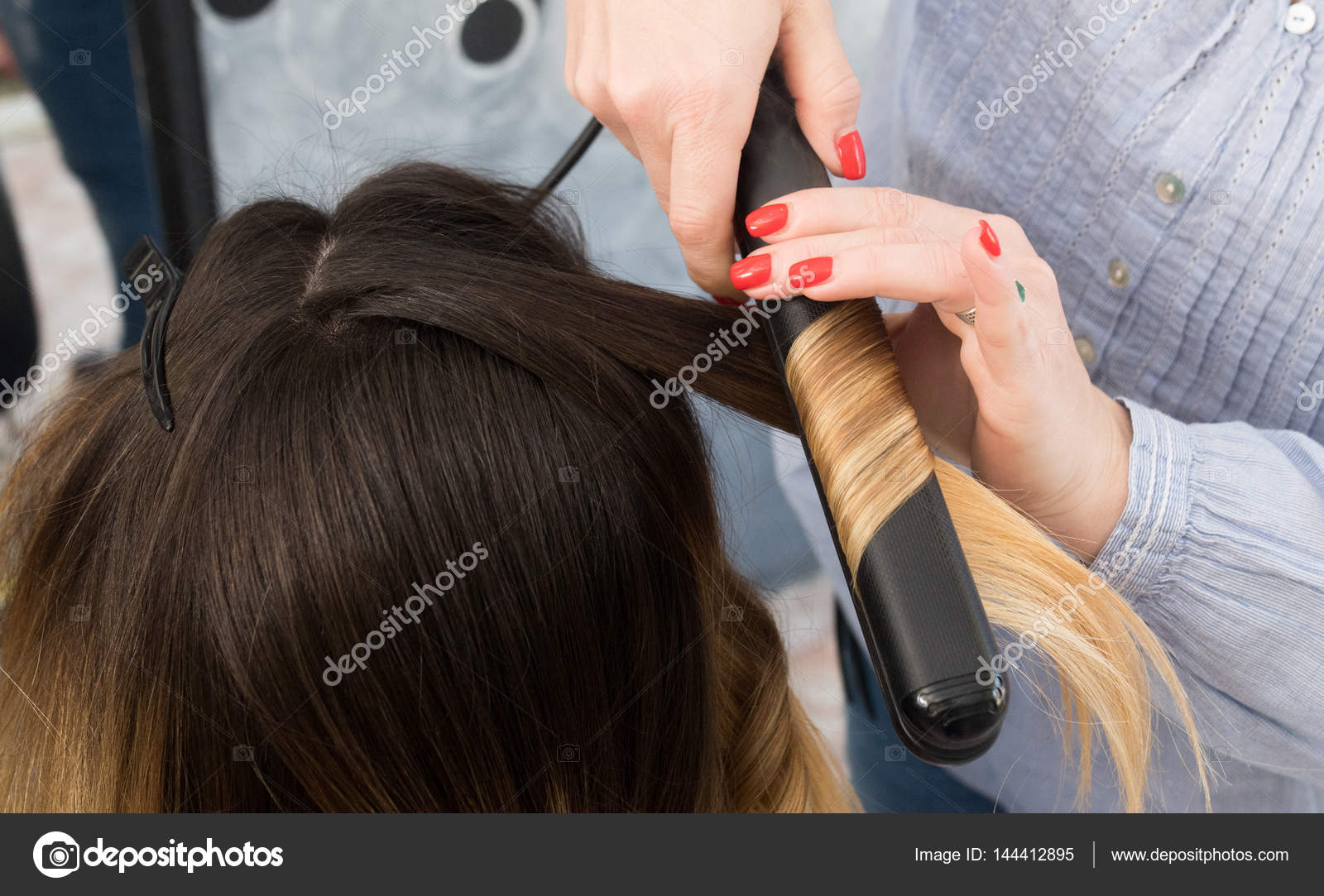 Professional Hairdresser Curling Ombre Hair With Iron In Beauty