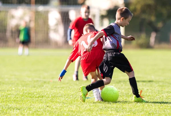 Kids soccer football - young children players match on soccer fields — Stock Photo, Image