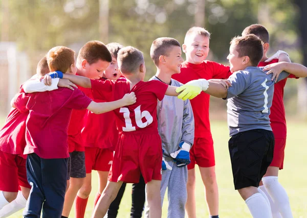 Kids soccer football -  children players celebrating after victo — Stock Photo, Image
