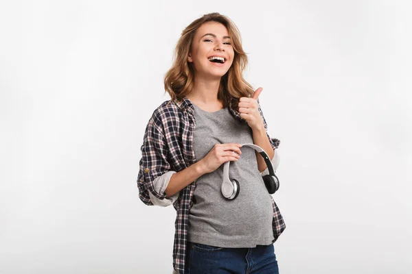 Auriculares en la barriga — Foto de Stock