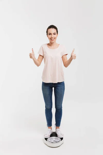 Young Woman Showing Thumbs While Standing Scales Isolated White — Stock Photo, Image