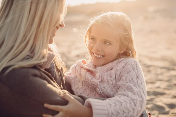 Mother hugging her daughter — Stock Photo