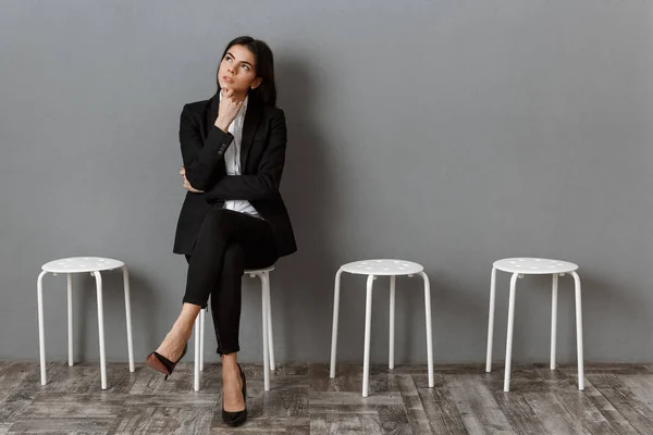 Pensive businesswoman in suit waiting for job interview — Stock Photo