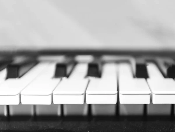 Black and white piano keys, side view. Selective focus. The conc Stock Photo