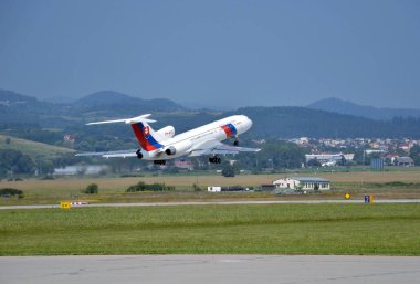 Tupolev Tu-154 airplane of Slovak Government Flying Service takes off from runway clipart