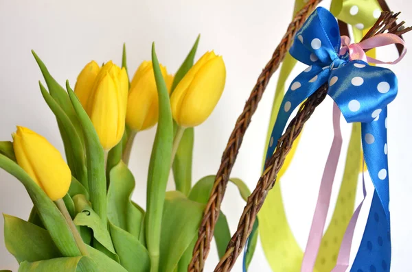 Spring Composition Two Easter Whips Bunch Yellow Tulips Empty Background Stockafbeelding