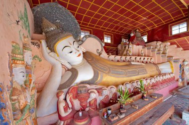 Shan. Myanmar. 11/29/2016. A favorite place for tourist excursions - Takhaung Mwetaw pagoda, where more than 200 stupas, with a unique bas-reliefs. Ragada located on the shores of Inle lake. clipart