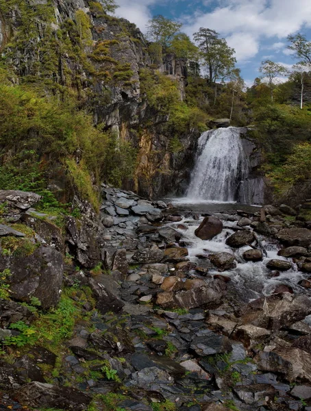 Russia. mountain Altai. Korbu waterfall is the most visited place of tourists all over the world on lake Teletskoye. It is at this waterfall the deepest place of the lake (325m).