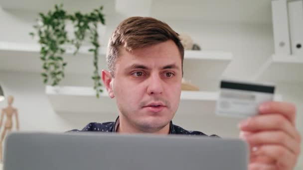 A Young Man Using a Laptop Indoors — Stock Video