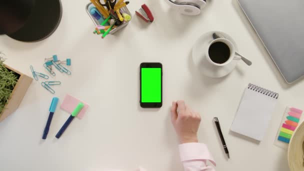 A Finger Touching a Smartphone with a Green Screen — Stock Video