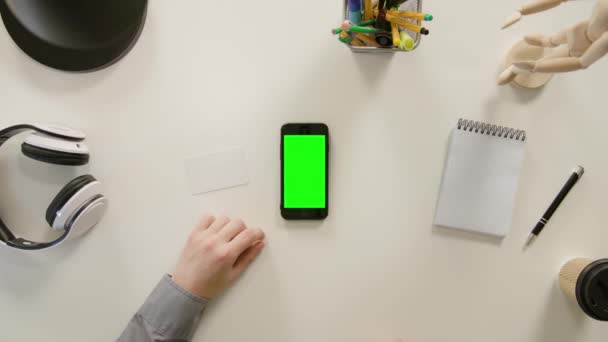 A Finger Touching a Green Screen of the Smartphone — Stock Video