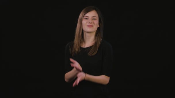 A Lady Mimicing Against a Black Background — Stock Video