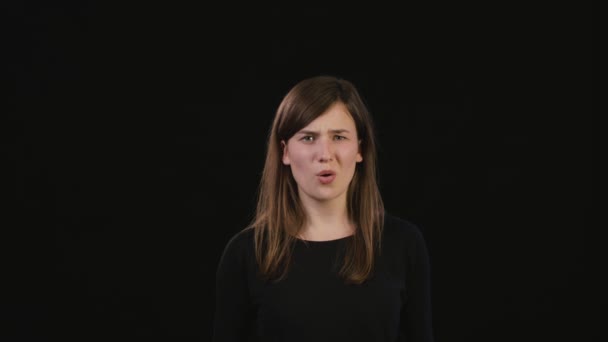 A Lady Mimicing Against a Black Background — Stock Video