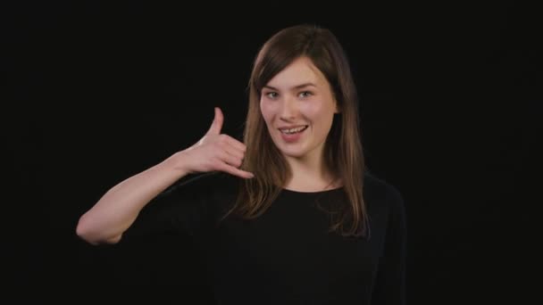 A Lady Mimicing Against a Black Background — Stock Video