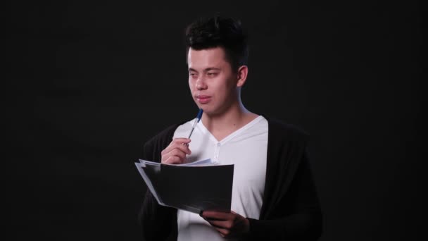 A Young Man Mimicing Against a Black Background — Stock Video