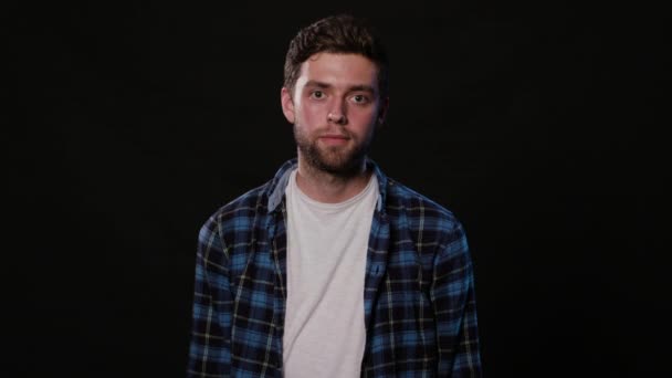 A Young Man Mimicing Against a Black Background — Stock Video