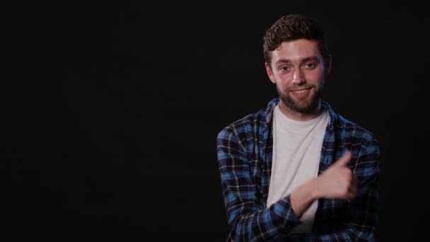 A Young Man Mimicing Against a Black Background — Stock Video