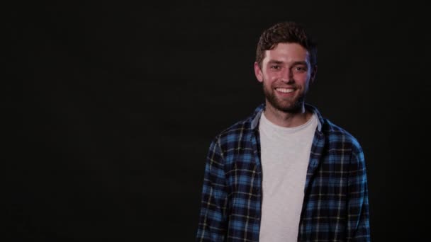 A Young Man Mimicing Against a Black Background — Stock Video