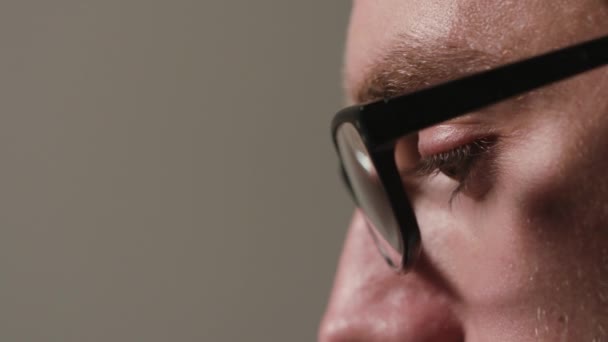 Close-up of a Mans Face Against a Black Background — Stock Video