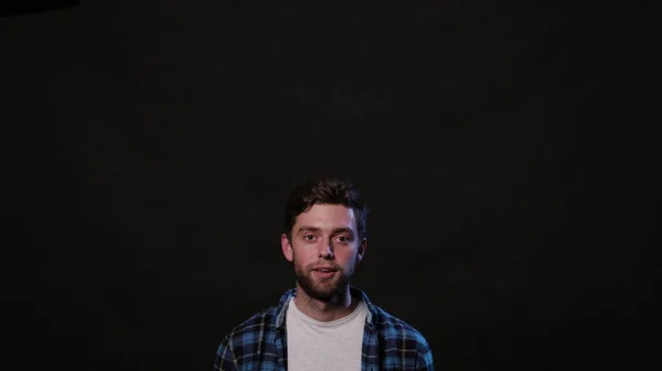 A Young Man Mimicing Against a Black Background — Stock Photo, Image