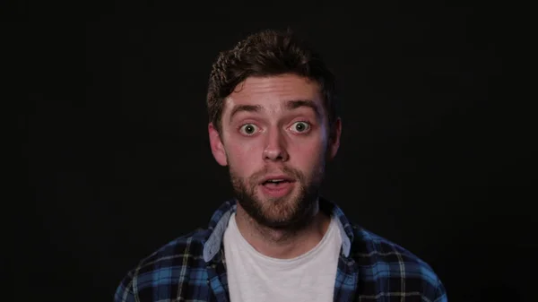 A Young Man Mimicing Against a Black Background — Stock Photo, Image