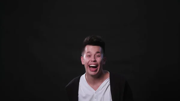 A Young Man Mimicing Against a Black Background — Stock Photo, Image