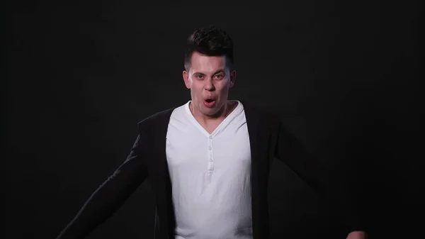 A Young Man Mimicing Against a Black Background — Stock Photo, Image