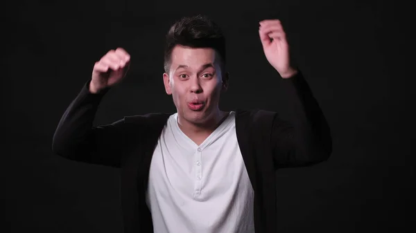 A Young Man Mimicing Against a Black Background — Stock Photo, Image