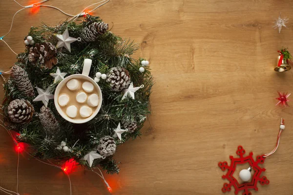 Christmas wreath with cup of hot cocoa and marshmallo