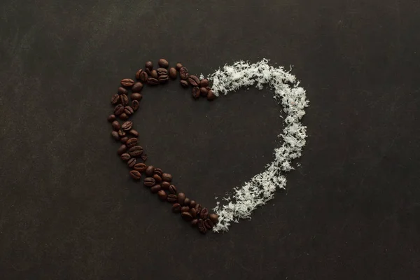 Heart made of coffee beans and coconut chips — Stock Photo, Image