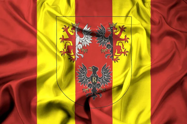 Viftande flagga Lodz vojvodskap med vapensköld, Polen — Stockfoto