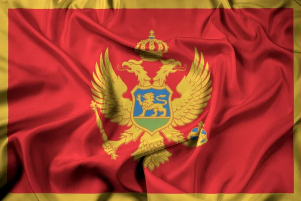 Vlající vlajka Černé hory — Stock fotografie