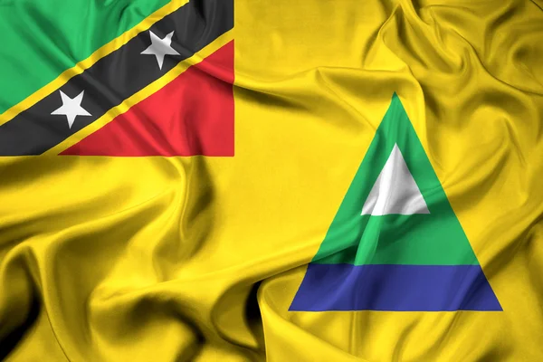 Viftande flagga av Nevis, Saint Kitts och Nevis — Stockfoto