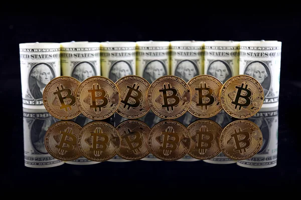 Physical version of Bitcoin (new virtual money) and banknotes of one dollar. Exchange bitcoin for a dollar. Conceptual image for worldwide cryptocurrency and digital payment system. — Stock Photo, Image
