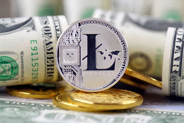 Physical version of Litecoin (new virtual money) and banknotes of one dollar. Exchange Litecoin for a dollar. Conceptual image for worldwide cryptocurrency and digital payment system. — Stock Photo, Image