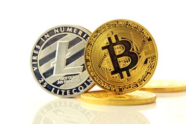 Physical version of Bitcoin and Litecoin, new virtual money. Conceptual image for worldwide cryptocurrency and digital payment system called the first decentralized digital currency. clipart